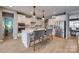 Modern kitchen featuring stainless steel appliances, quartz countertops, a breakfast bar and pendant lighting at 5431 Meadowcroft Way, Fort Mill, SC 29708