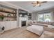 Cozy living room with a fireplace, built-in shelving, and sliding doors that provide plenty of natural light at 5431 Meadowcroft Way, Fort Mill, SC 29708