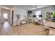 Bright home office space with hardwood floors, ceiling fan, and built-in shelves at 5431 Meadowcroft Way, Fort Mill, SC 29708
