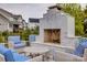 An outdoor fireplace with lounge seating, perfect for entertaining or relaxing with Gathering and friends at 5431 Meadowcroft Way, Fort Mill, SC 29708
