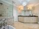 Elegant bathroom featuring a soaking tub, walk-in shower, and a double sink vanity at 5824 Preston Ln, Charlotte, NC 28270