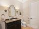Cozy bathroom with vanity, granite counter, and classic fixtures creating a comfortable and functional space at 5824 Preston Ln, Charlotte, NC 28270