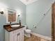 Charming bathroom featuring a stylish vanity with a vessel sink and a walk-in shower with elegant tile at 5824 Preston Ln, Charlotte, NC 28270