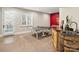 Spacious game room in the basement with a ping pong table, and a bar area at 5824 Preston Ln, Charlotte, NC 28270