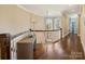 Bright hallway with hardwood floors, curved railing, and lots of natural light at 5824 Preston Ln, Charlotte, NC 28270