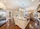 Spacious open kitchen featuring a large island, stone countertops, and stainless steel appliances at 5824 Preston Ln, Charlotte, NC 28270