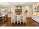 Beautiful kitchen featuring a large island, white cabinetry, and modern appliances for a stylish and functional cooking space at 5824 Preston Ln, Charlotte, NC 28270