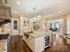 Spacious kitchen features a large island, stainless steel appliances, and a built-in wine cooler at 5824 Preston Ln, Charlotte, NC 28270