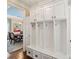 Well-organized mudroom with custom built-in storage, drawers, and seating for convenient organization at 5824 Preston Ln, Charlotte, NC 28270