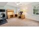 Home office setup with a large desk area, chair, and natural light, providing ample space to work at 5824 Preston Ln, Charlotte, NC 28270