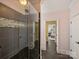 Contemporary glass shower featuring sleek gray tile in the bathroom at 5824 Preston Ln, Charlotte, NC 28270