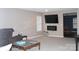 Inviting living area with a wall-mounted fireplace, cozy seating, and open access to the dining area, perfect for entertaining at 610 Trillium Sw Ct # 14, Conover, NC 28613