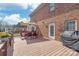 Inviting back deck with outdoor seating, umbrella and grill, perfect for entertaining at 7925 Tottenham Dr, Harrisburg, NC 28075