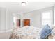 Neutral bedroom with a double bed, dresser, and mirrored closet providing ample storage at 7925 Tottenham Dr, Harrisburg, NC 28075
