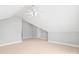 Bright bonus room featuring neutral walls and carpet at 7925 Tottenham Dr, Harrisburg, NC 28075