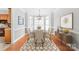 Staged dining room with buffet cabinet and view of the backyard at 7925 Tottenham Dr, Harrisburg, NC 28075