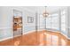 Bright dining room featuring wood floors and natural light at 7925 Tottenham Dr, Harrisburg, NC 28075