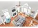 Bright living room boasts high ceilings, a fireplace, and large windows at 7925 Tottenham Dr, Harrisburg, NC 28075