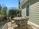 Outdoor dining set on balcony overlooking backyard at 8416 Highgrove St, Charlotte, NC 28277