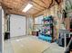 Unfinished basement area offering storage space, with a large rug and door access at 8416 Highgrove St, Charlotte, NC 28277