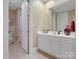 Bright bathroom with white cabinets and a large mirror for added light and style at 8416 Highgrove St, Charlotte, NC 28277