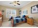 Charming bedroom with a ceiling fan, natural light and a personal sports theme at 8416 Highgrove St, Charlotte, NC 28277