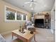 Relaxing bonus room with large windows, ceiling fan, cozy chair and entertainment center at 8416 Highgrove St, Charlotte, NC 28277