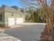 Long driveway leading to the attached two-car garage, providing ample parking space at 8416 Highgrove St, Charlotte, NC 28277