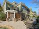 Beautiful backyard with patio, spiral staircase, outdoor seating, and lush landscaping at 8416 Highgrove St, Charlotte, NC 28277