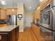 Modern kitchen with stainless steel appliances, granite countertops, and ample cabinet space at 8416 Highgrove St, Charlotte, NC 28277