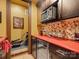 Charming kitchenette with sleek cabinets, stainless steel microwave, and a vibrant red countertop at 8416 Highgrove St, Charlotte, NC 28277