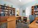 Bright home office with custom built-in bookshelves and plenty of desk space at 8416 Highgrove St, Charlotte, NC 28277