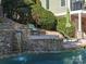 Backyard waterfall feature with stone walls at 8416 Highgrove St, Charlotte, NC 28277