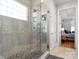 Modern shower design with stone tile accents and multiple shower heads at 8416 Highgrove St, Charlotte, NC 28277