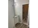 Stylish bathroom with a granite vanity and a newly tiled shower with a glass door at 8515 Mission Hills Rd, Charlotte, NC 28227