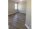 Neutral bedroom with new flooring and natural light perfect for relaxation and rest at 8515 Mission Hills Rd, Charlotte, NC 28227