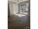 Bright dining room with large windows and new floors offers the perfect space to entertain guests at 8515 Mission Hills Rd, Charlotte, NC 28227