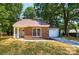 Charming single-Gathering brick home with a well-manicured lawn and an attached garage at 8515 Mission Hills Rd, Charlotte, NC 28227