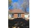 Charming brick home with a well-maintained yard and attached two-car garage at 8515 Mission Hills Rd, Charlotte, NC 28227