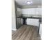 Modern kitchen featuring white cabinets, stainless steel appliances, and granite countertops at 8515 Mission Hills Rd, Charlotte, NC 28227