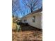 Side yard featuring classic white siding and space for outdoor activities and relaxation at 8515 Mission Hills Rd, Charlotte, NC 28227