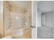 Bright bathroom features a shower and tub combination with a tile surround and neutral-toned walls at 876 Summerlake Dr, Fort Mill, SC 29715