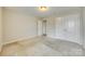 Bedroom featuring carpeting, neutral paint, access to other rooms, and closet with double doors at 876 Summerlake Dr, Fort Mill, SC 29715