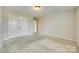 Carpeted bedroom with neutral paint, closet with double doors, and access to other rooms at 876 Summerlake Dr, Fort Mill, SC 29715