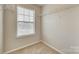 Walk-in closet featuring wire shelving, natural light from a window, and neutral carpeting at 876 Summerlake Dr, Fort Mill, SC 29715