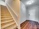 Bright foyer with hardwood floors, a staircase, and a white front door at 876 Summerlake Dr, Fort Mill, SC 29715