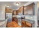 Well-equipped kitchen with stainless steel appliances, granite countertops, dark wood cabinets, and a tile backsplash at 876 Summerlake Dr, Fort Mill, SC 29715