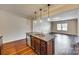 Open kitchen with a large island, granite countertops, stainless steel dishwasher, and pendant lighting at 876 Summerlake Dr, Fort Mill, SC 29715