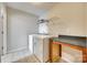 Laundry room features white washer and dryer, tile floor, and overhead shelving at 876 Summerlake Dr, Fort Mill, SC 29715