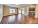 Spacious living room with hardwood floors, natural light, and an open layout connected to the dining area at 876 Summerlake Dr, Fort Mill, SC 29715